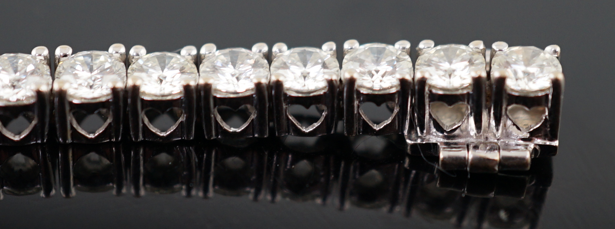 An 18k white gold and diamond line bracelet